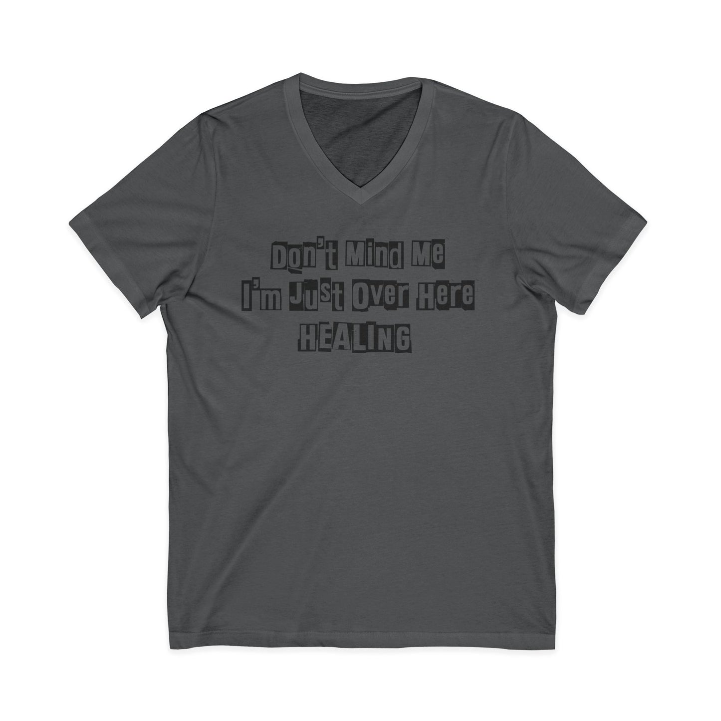 Charcoal JohnT V-neck T-shirt with the printed text “Don’t Mind Me I’m Just Over Here Healing” displayed flat on a plain background.