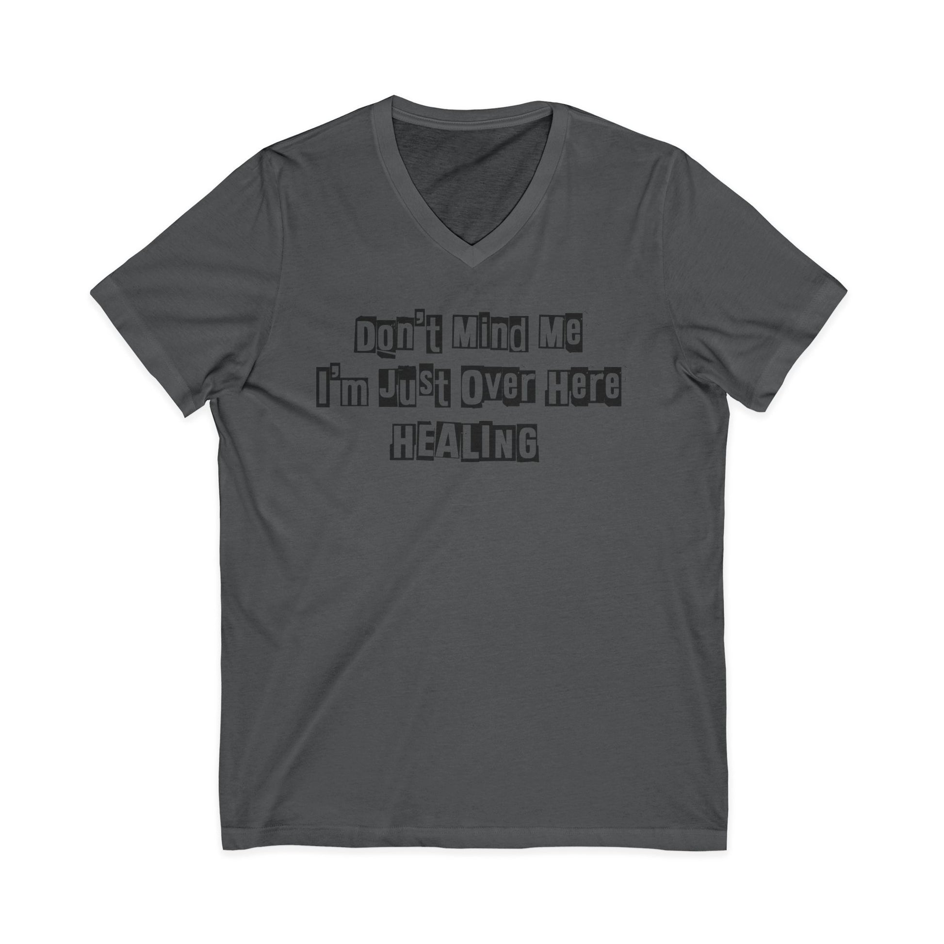 Charcoal JohnT V-neck T-shirt with the printed text “Don’t Mind Me I’m Just Over Here Healing” displayed flat on a plain background.