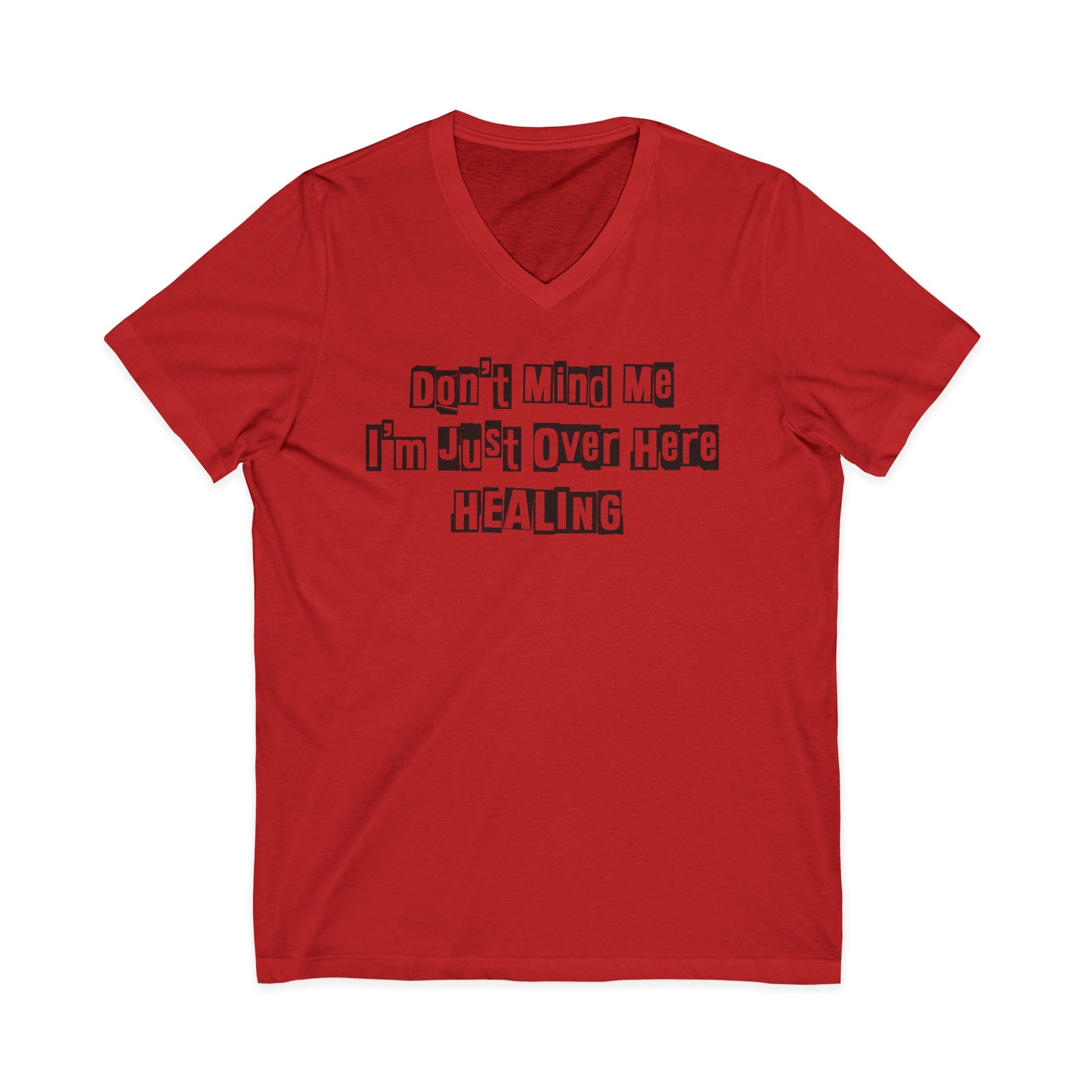Red JohnT V-neck T-shirt with the printed text “Don’t Mind Me I’m Just Over Here Healing” displayed flat on a plain background.