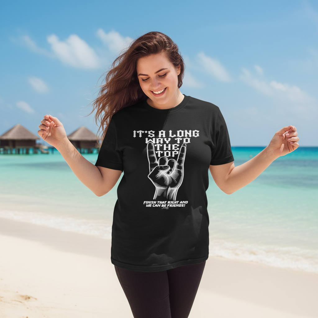 Woman wearing an “It’s a long way to the top” rock hand T-shirt walking on a sunny tropical beach.