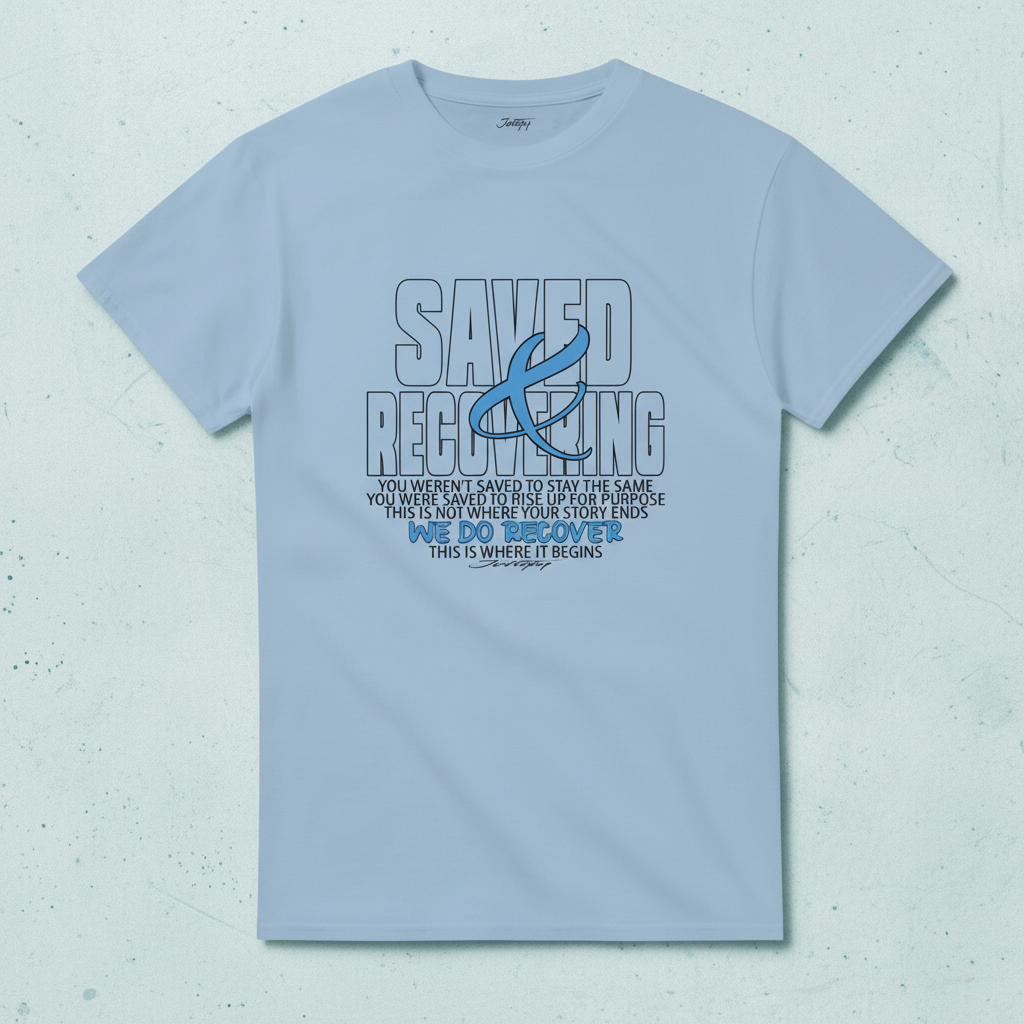 Johny-T “Saved & Recovering” inspirational recovery T-shirt in Light Blue displayed in a clean high-resolution studio flatlay mockup.