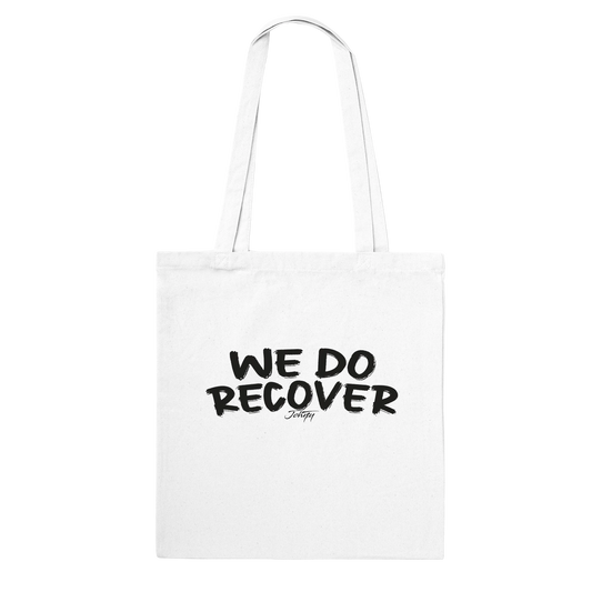 Johny-T “We Do Recover” inspirational white tote bag shown in a clean high-resolution front-view studio mockup.