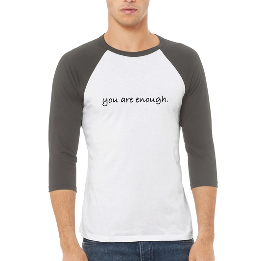 Inspirational raglan T-shirt featuring the phrase "you are enough." in a clean, handwritten font on a white and charcoal baseball-style shirt. A minimalist, uplifting design promoting self-worth, confidence, and positivity — perfect for casual everyday wear or as a thoughtful gift.